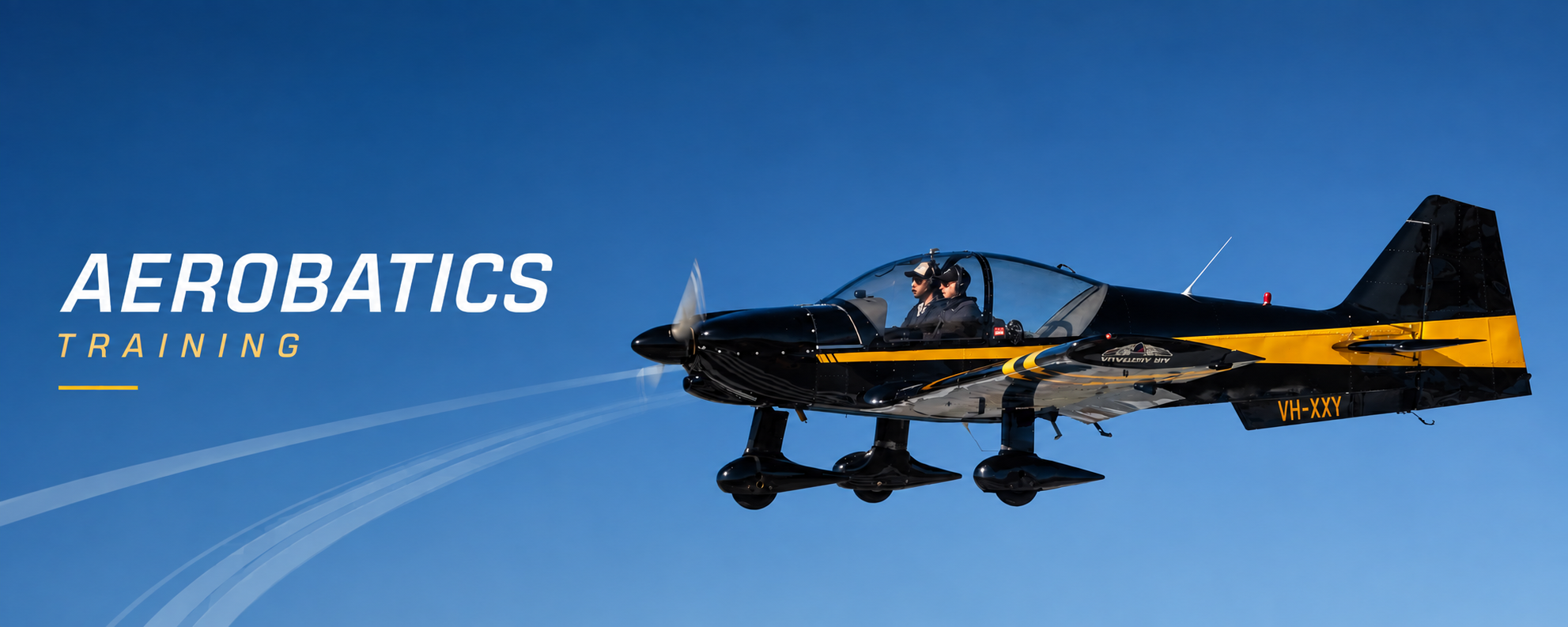 Aerobatics training banner showing a black and yellow aerobatic aircraft over a blue sky